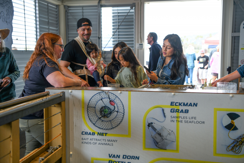 A family exploring the Sea Center 