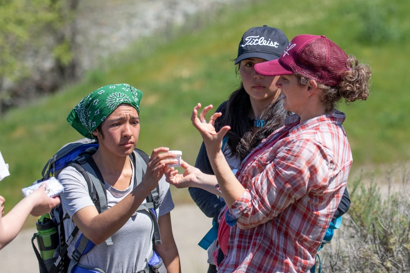 Maupin (at right) teaching spider sampling methods to BIOL 130 students in the field. Photo by Adam Green