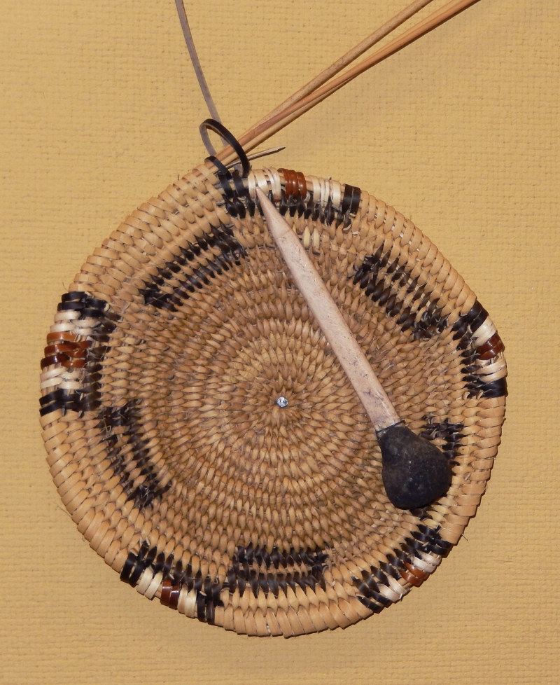 The beginning of a coiled basket, with a traditional awl